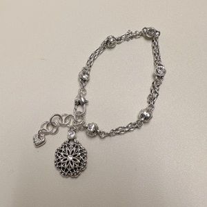 Brighton, silver tone, chain link charm bracelet with medallion charm. 7.5"